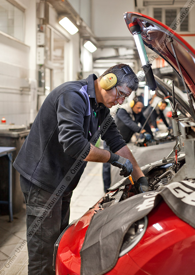 Erel Automotive Car Showroom maintenence service worker close up