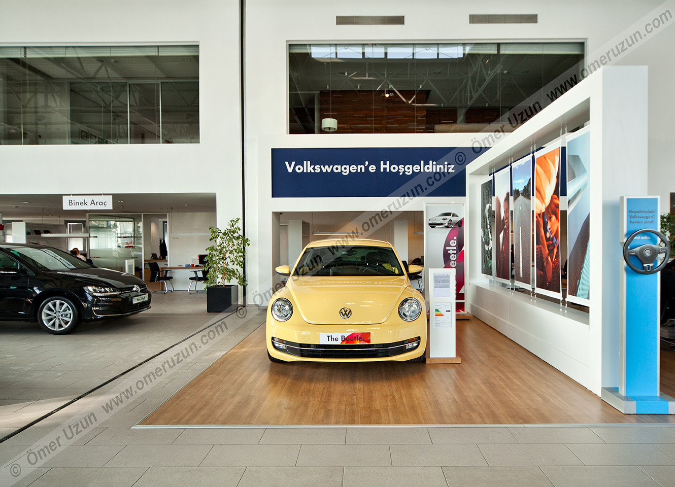 Erel Automotive Car Showroom interior view yellow volkswagen beetle close up