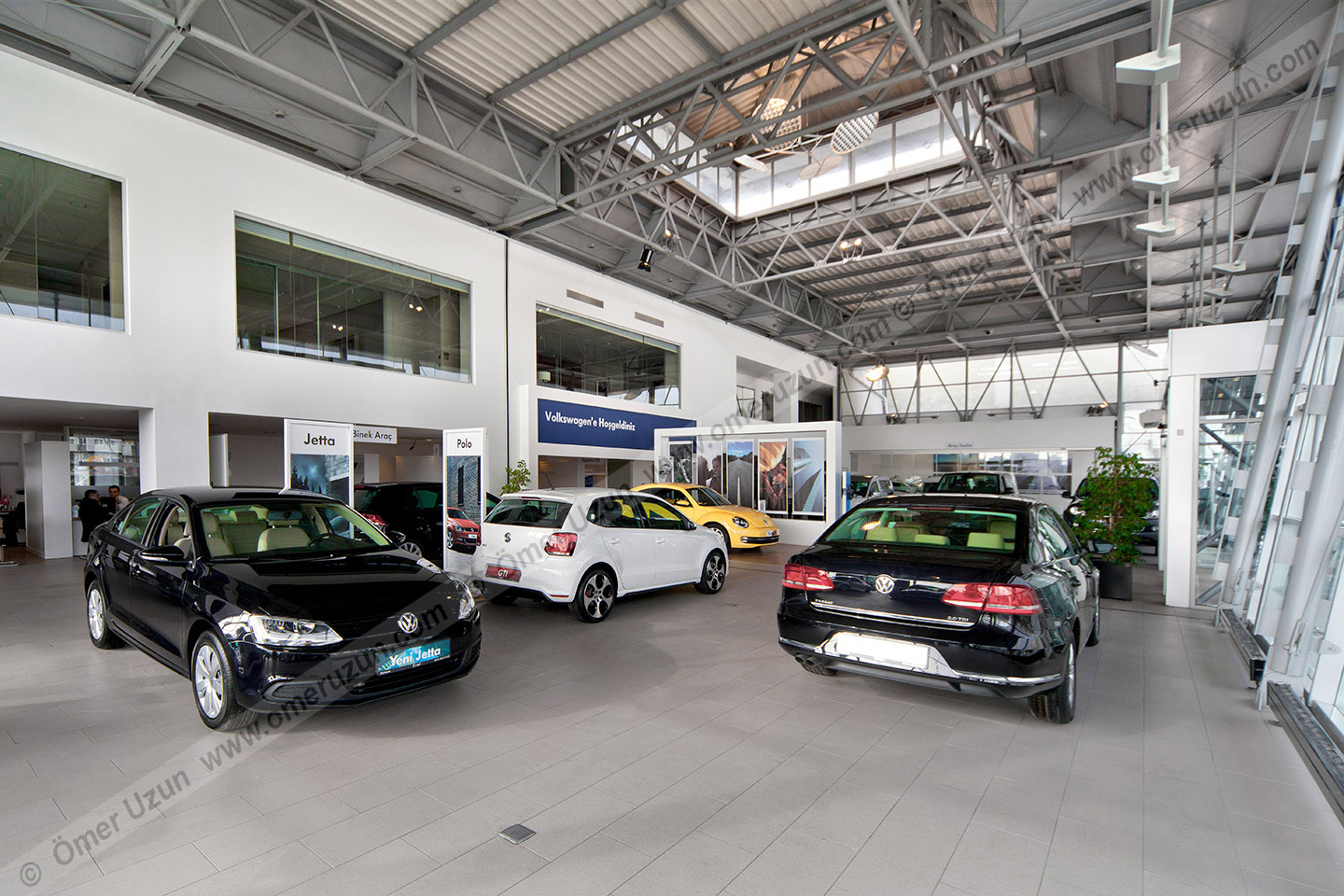 Erel Automotive Car Showroom interior view black volkswagen jetta close up with other cars